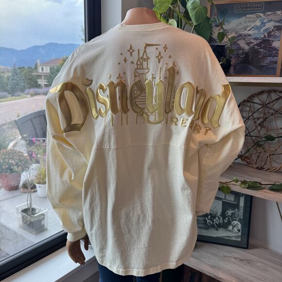 Disneyland Resort Pixie Dust Cream/Gold Spirit Jersey w/ Gold Foil Logo, Large - Picture 1 of 10